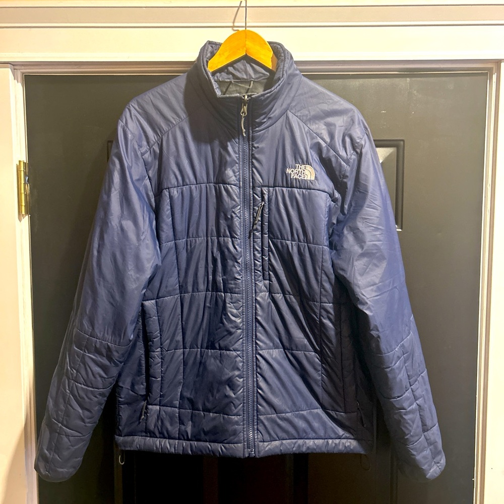 The North Face men’s blue puffer jacket, size medium